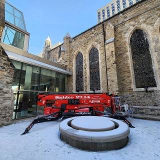 Spider Lift Operations On Snowy Grounds 