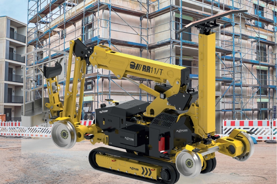 Spider lift operating inside a warehouse with safety barriers