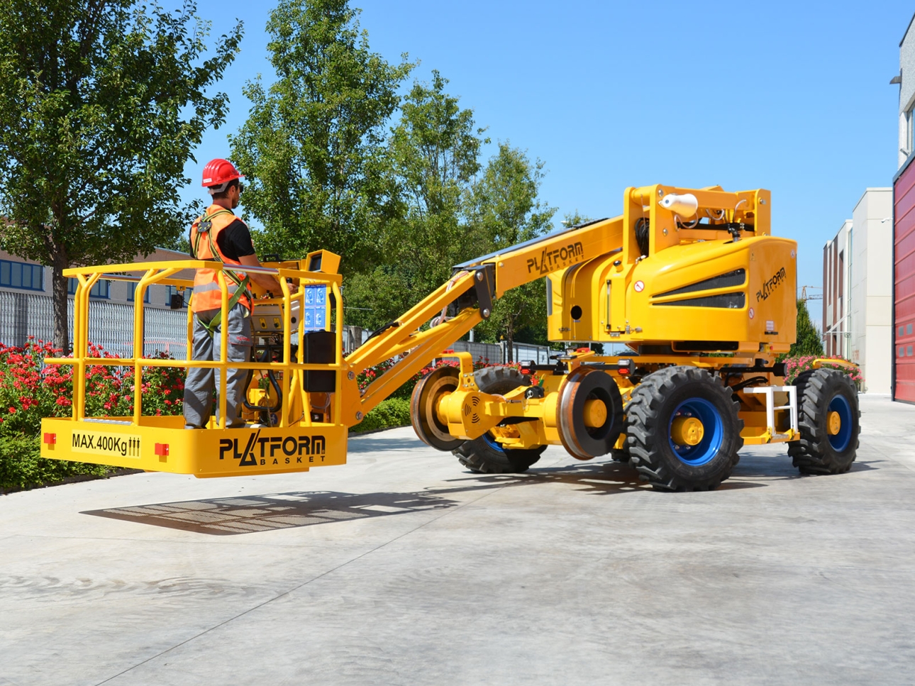 RR 9/200 versatile rail-road aerial lift positioned on solid ground for multi-terrain access.