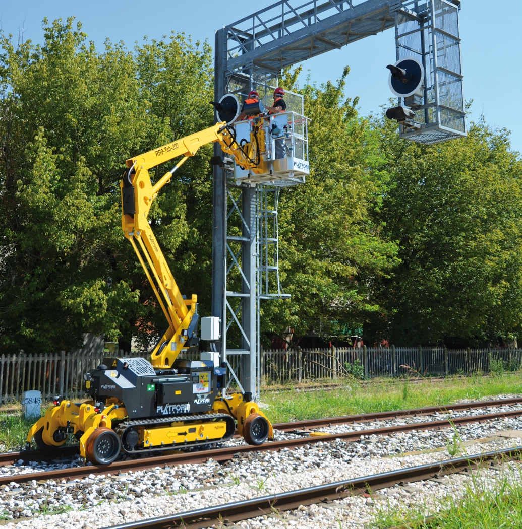 RR 9/200 rail-road aerial lift deployed on railway tracks for overhead maintenance work.