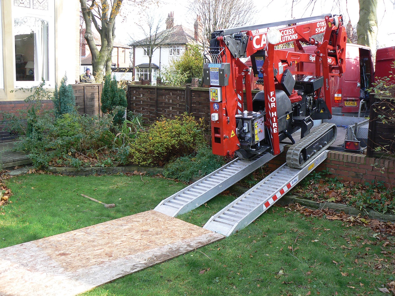 Spider 13.80 lift being deployed on a ramp for access to a work area.