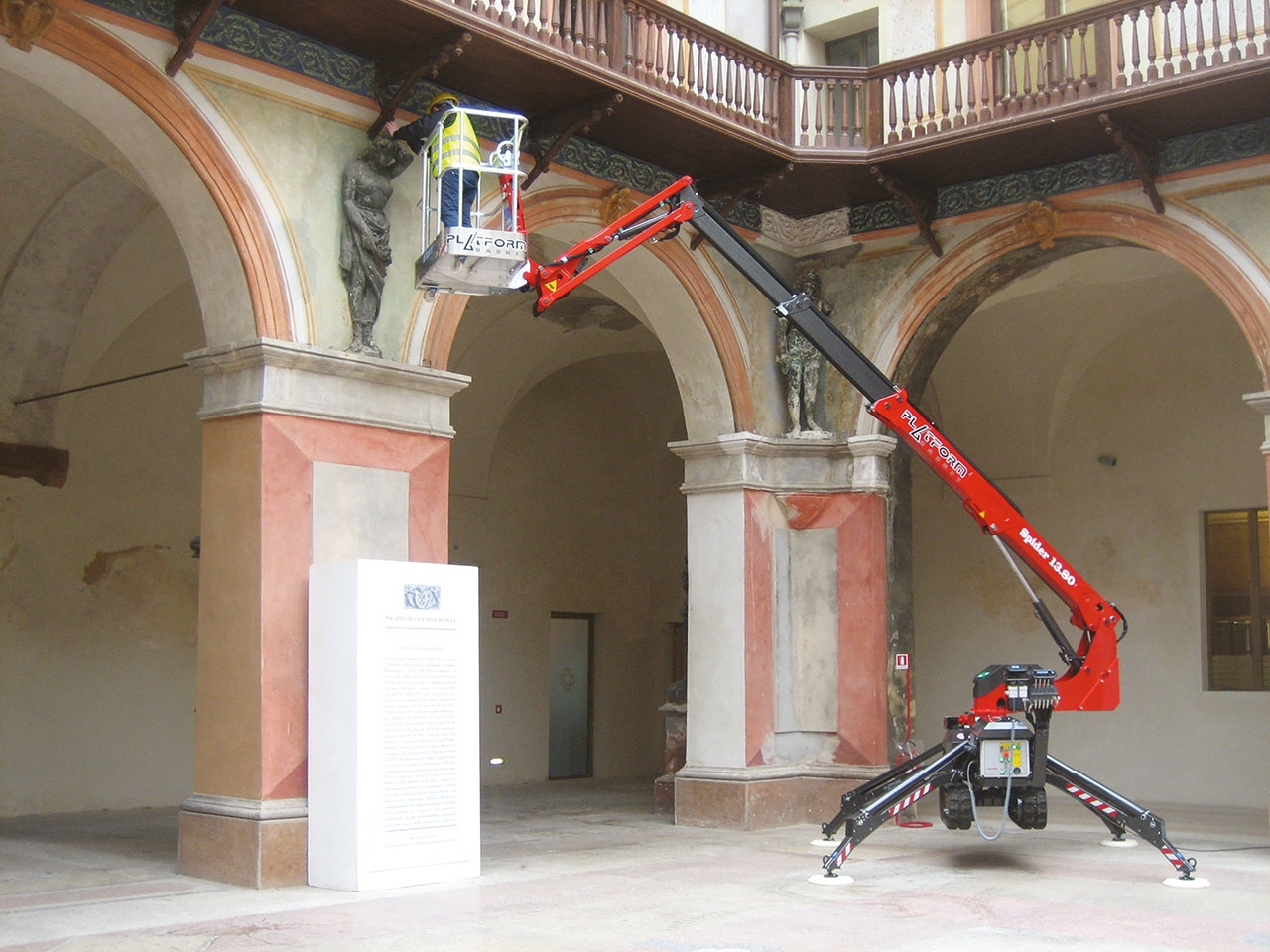 Spider 13.80 lift positioned indoors for restoration work on a historic building.