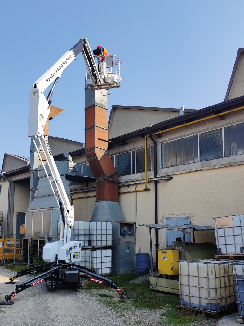 Spider 15.70 lift in action for residential roof maintenance and repairs.