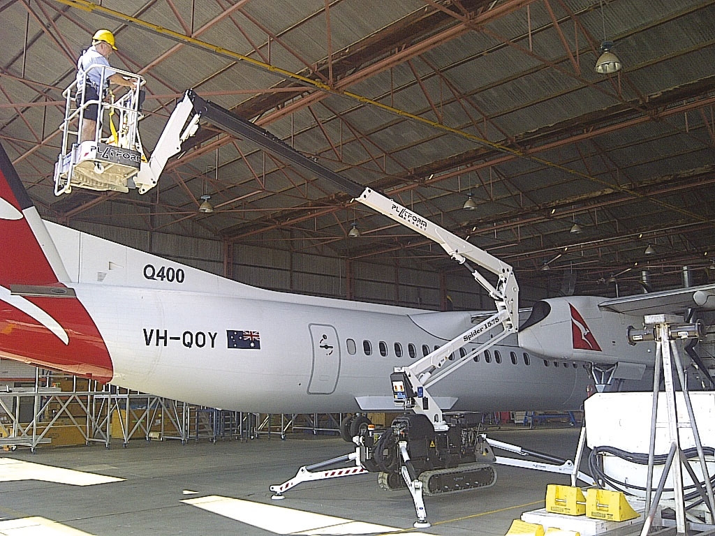 Spider 15.75 lift used for aircraft maintenance inside a hangar.