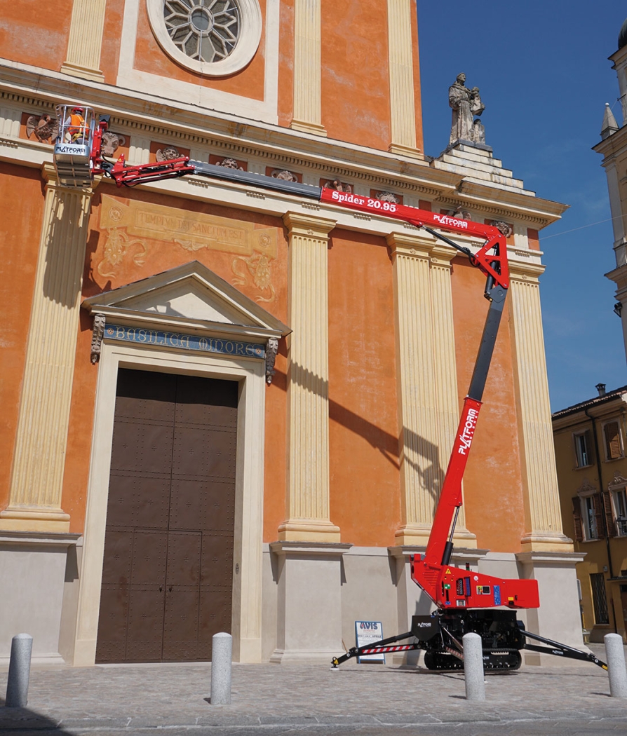 Spider lift fully extended outside a structure for high-area access