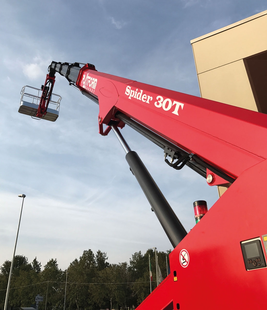 Close-up of a spider lift arm with a basket platform.