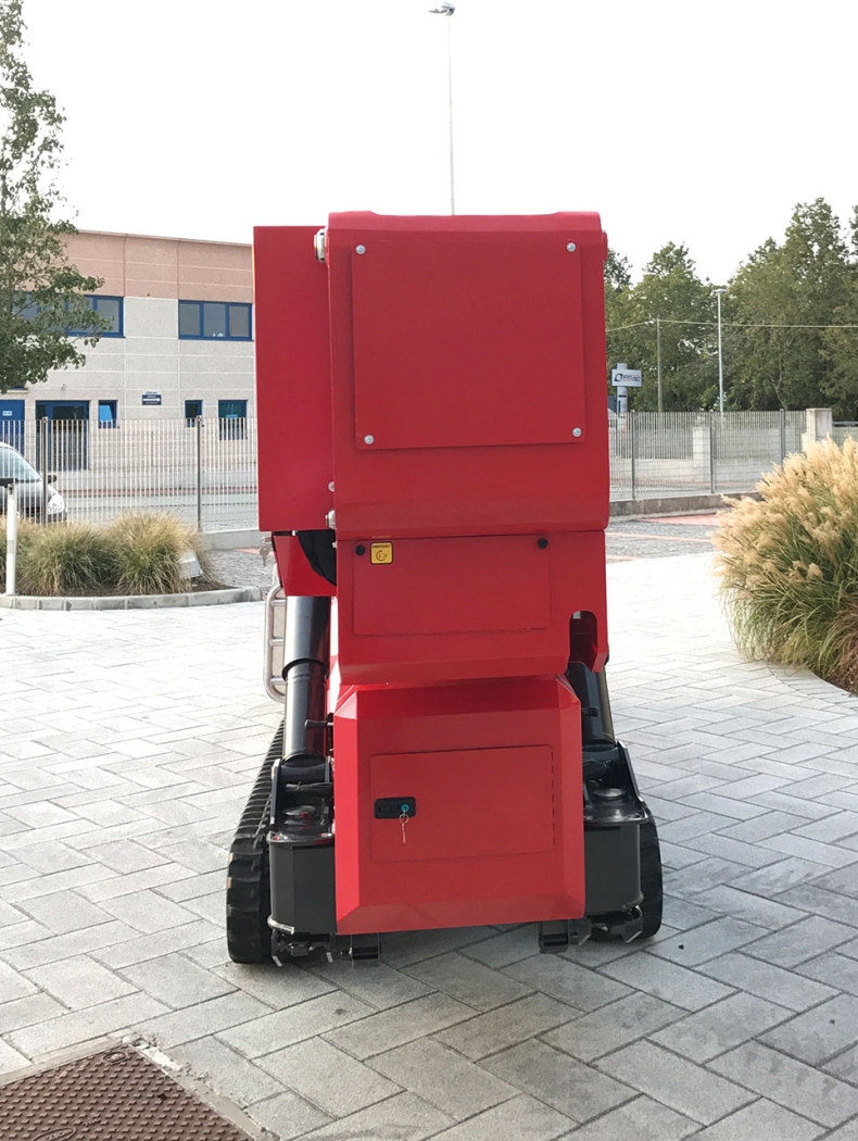 Rear view of a red spider lift in transport mode.