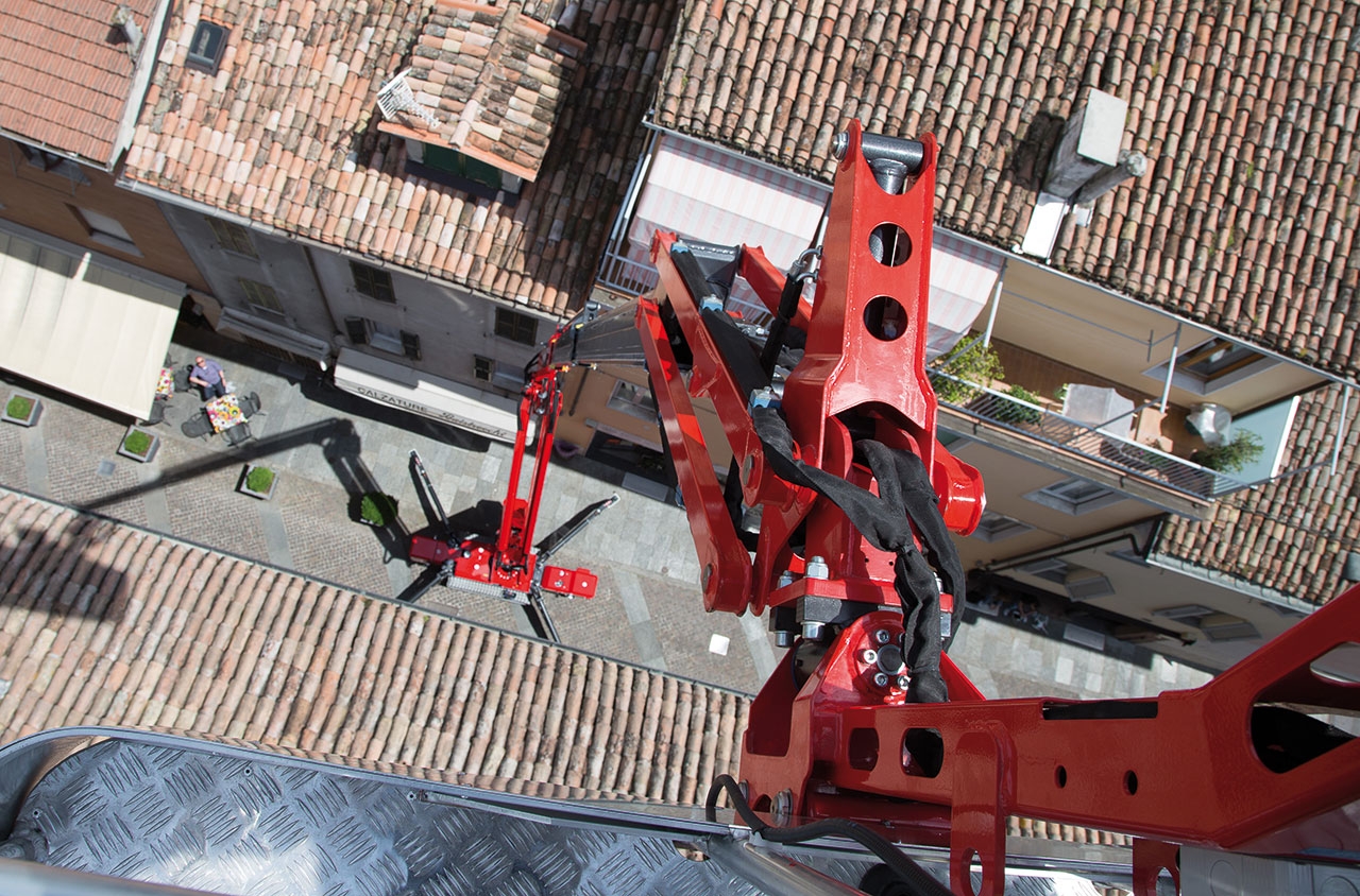 Top-down view of a spider lift in use on a rooftop.